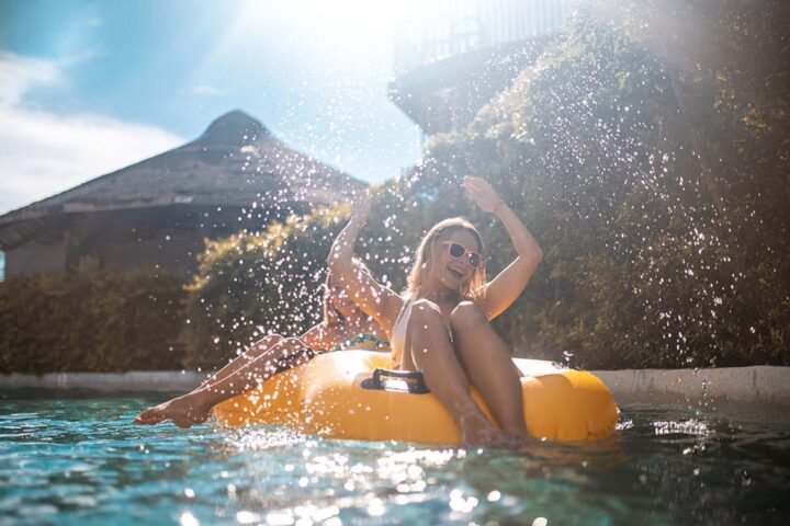 moneyplus girl in pool ten things to help afford summer holidays