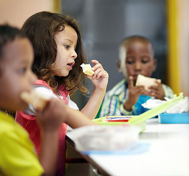 kid eating lunch moneyplus kid eating lunch packed lunches vs school meals