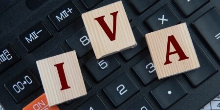 How-IVAs-are-Reshaping-Debt-Management-in-the-UK-feature An image of a computer keyboard with scrabble letters I, V, and A