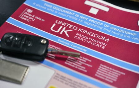 Image of a Registration Certificate with a pair of keys on top