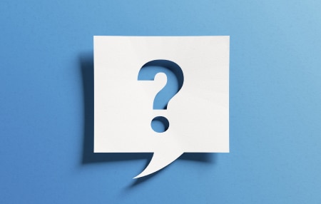 Image of a blue background with a question mark in a white speech box