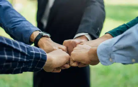 Image of 5 people fist pumping