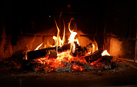 Image of fire blazing in a fireplace