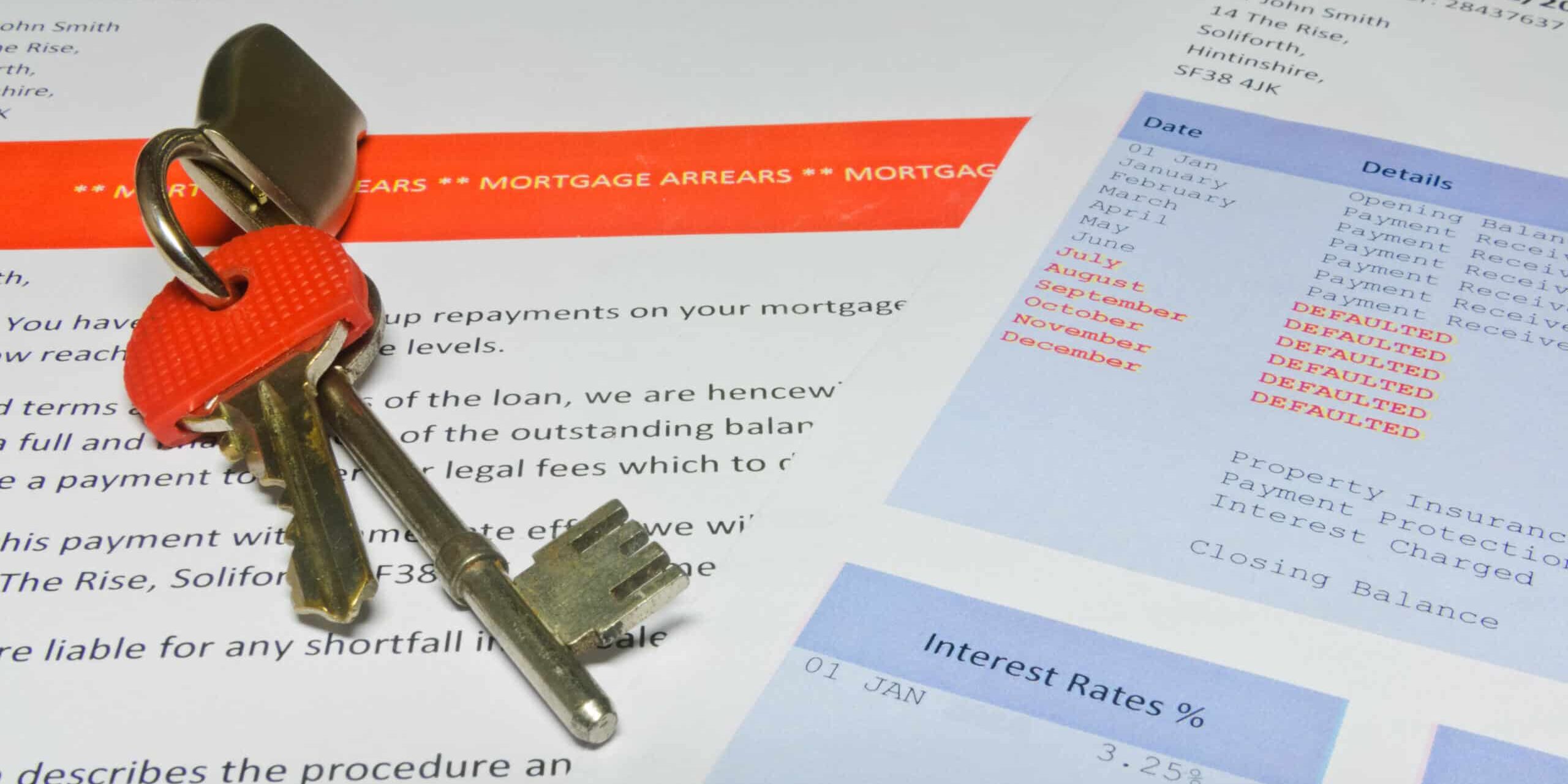 House keys on a bank letter informing customer of Mortgage Arrears and repossession with bank statement ( (Letter contains fake name and details. IP belongs to submitter) A mortgage arrears notice and mortgage statement with house keys on top.