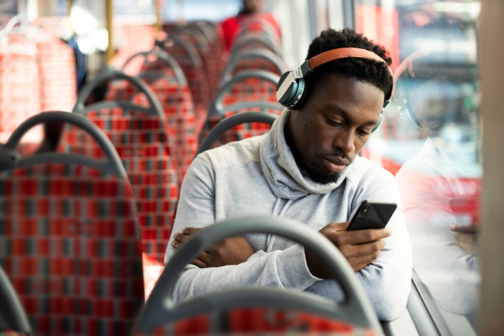 Man on the bus listening to music