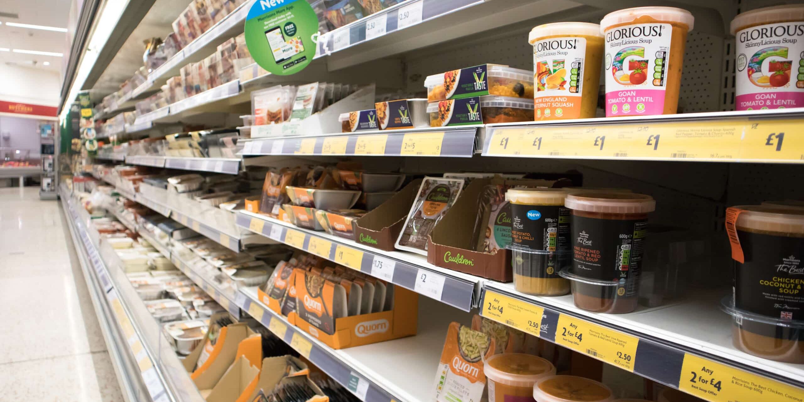 Supermarket display of chilled food on shelves for purchase in a fridge